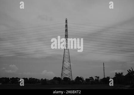 Monochrome photo, view of signal tower and electricity distribution tower, Cikancung - Indonesia Stock Photo