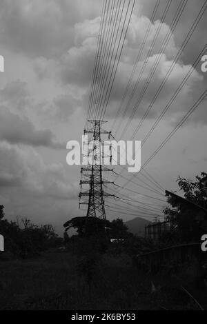 Monochrome photo, view of signal tower and electricity distribution tower, Cikancung - Indonesia Stock Photo