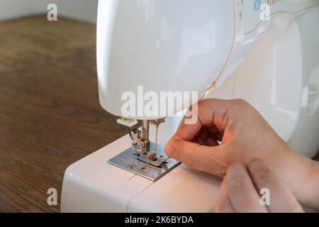 Thread needle hi-res stock photography and images - Alamy