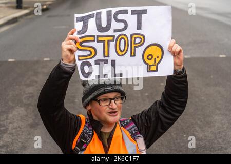 London UK. 13 October 2022 . Just stop oil climate activists stage a sit in Whitehall as they continue their daily protest for  the 13th day in a row  as they renew their calls for the UK government to halt new fossil fuel licensing and production. Credit: amer ghazzal/Alamy Live News. Stock Photo