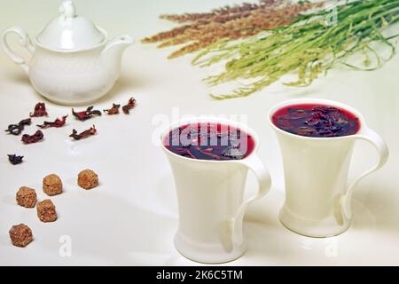 Herbal tea from Sudanese rose hibiscus flowers and mint in elega Stock Photo