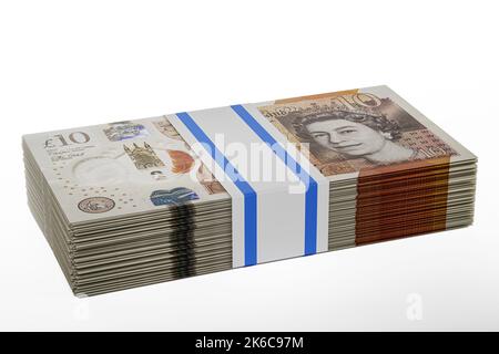 pile piles of UK money stack stacks of british polymer £10 notes bundle bundles of ten pound banknotes Stock Photo