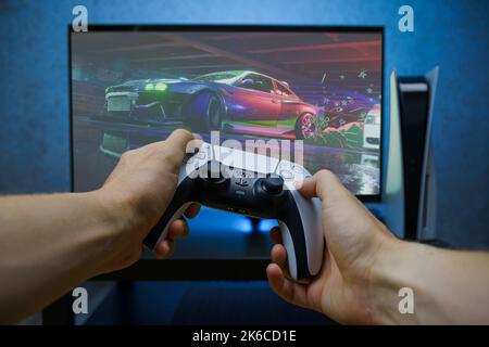 Vilnius, Lithuania - 13 October 2022: Close up shot of playing Need for Speed Unbound video game on Playstation console Stock Photo