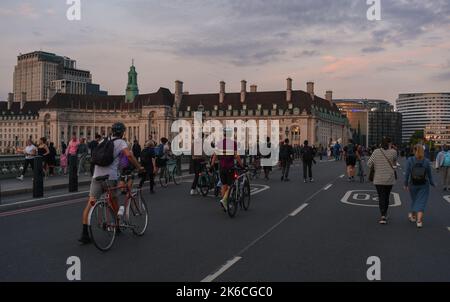 crowds of People Walk in the road over Westminster Bridge taking advantage of the road closure due to Queen lying in state ceremony. Stock Photo