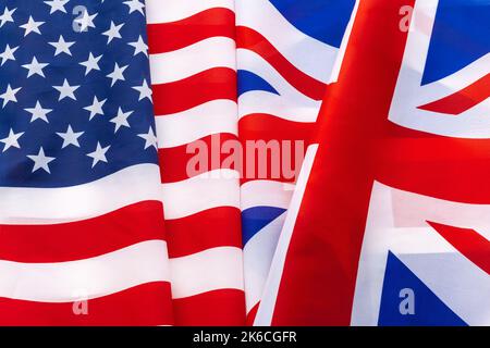 Flags of the USA and brithish Union Jack flag together waving Stock Photo