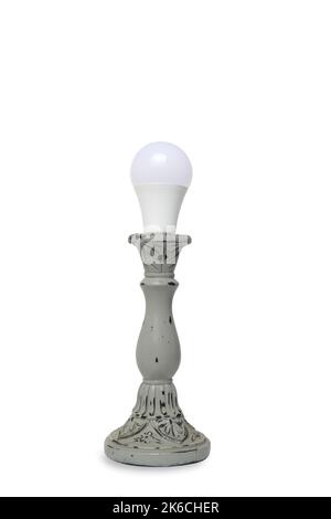 LED economical light bulb in candlestick on white background Stock Photo