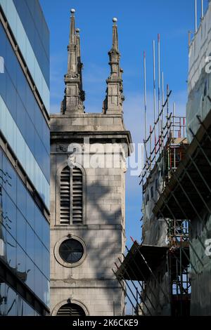 St Marys Somerset church tower hidden amongst the tall building either side. The church was destroyed in the great fire of London & rebuilt. Stock Photo