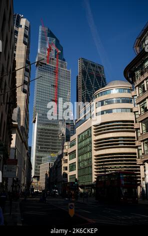 A view looking up Gracechurch street towards Bishopgate at the construction work on the new skyscrapers in the financial district of London UK. Stock Photo