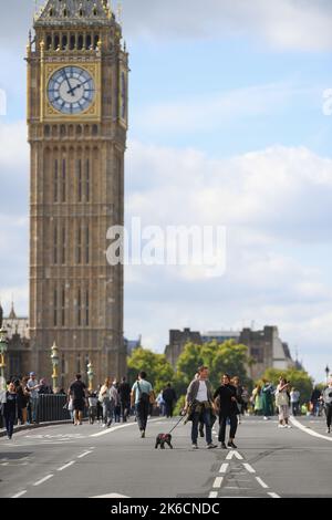 Members of the public take the chance to walk on the road at Westminster Bridge after the bridge is shut to traffic for Queens lying in state. Stock Photo