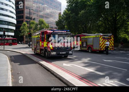 London Fire Brigade engines wait at Westminster Bridge as part of the Queens Lying in State moving ceremony. Stock Photo