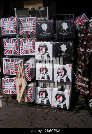 T-Shirt merchandise of the Late Queen in a London tourism shop on the first day of the Queens period of lying in state at the Place of Westminster. Stock Photo