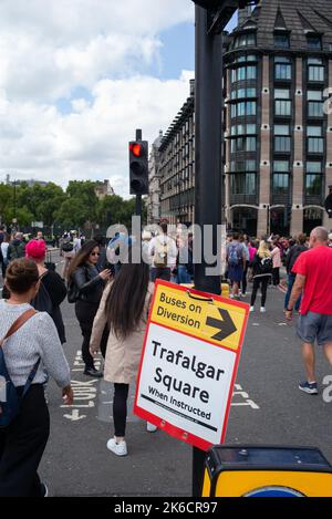 Crowds gather on Westminster Bridge exit as roads are closed for the movement of the Queens coffin to lye in state at Westminster Hall London UK. Stock Photo