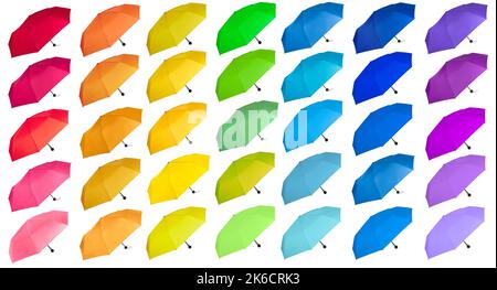 Large of rainbow colors umbrellas isolated on white background. Side view. Stock Photo
