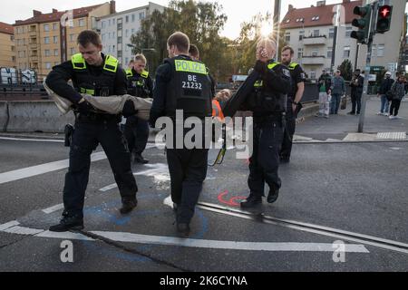 Berlin, Germany. 13th Oct, 2022. On October 13, 2022 climate activists again blocked freeway exits in Berlin. The climate activists are from the group Last Generation. They are demanding a speed limit on German freeways, as well as train rides that everyone can afford. (Photo by Michael Kuenne/PRESSCOV/Sipa USA) Credit: Sipa USA/Alamy Live News Stock Photo