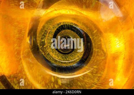 deep hole and dark spiral on yellow background. energy concept Stock Photo