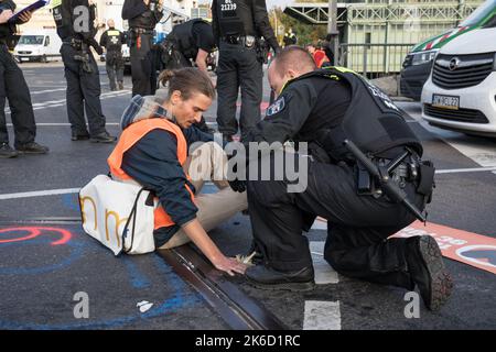 Berlin, Germany. 13th Oct, 2022. On October 13, 2022 climate activists again blocked freeway exits in Berlin. The climate activists are from the group Last Generation. They are demanding a speed limit on German freeways, as well as train rides that everyone can afford. (Credit Image: © Michael Kuenne/PRESSCOV via ZUMA Press Wire) Stock Photo