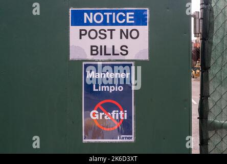 Sidewalk shed at a construction site posted with “Post No Bills” and in Spanish, “Mantener Limpio”, translating to Keep Clean in New York on Wednesday, October 5, 2022.  (© Richard B. Levine) Stock Photo