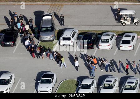 Parkland, USA. 14th Feb, 2018. In this file photo, students are evacuated by police out of Stoneman Douglas High School in Parkland, Florida, after a shooting on Wednesday, February 14, 2018. (Photo by Mike Stocker/Sun Sentinel/TNS/Sipa USA) Credit: Sipa USA/Alamy Live News Stock Photo