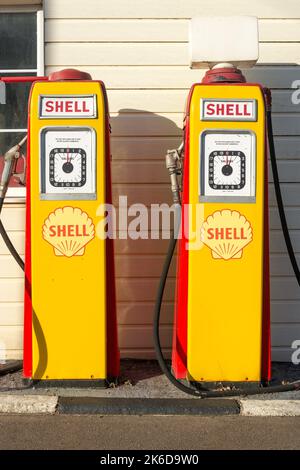1950's Shell Oil pumps at John's Motors Classic Car Garage, Watling Street East, Towcester, Northamptonshire, England, United Kingdom Stock Photo