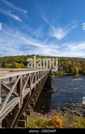 Historic Roebling Bridge also known as Roebling's Delaware Aqueduct over the Delaware River on a brilliant fall morning Stock Photo