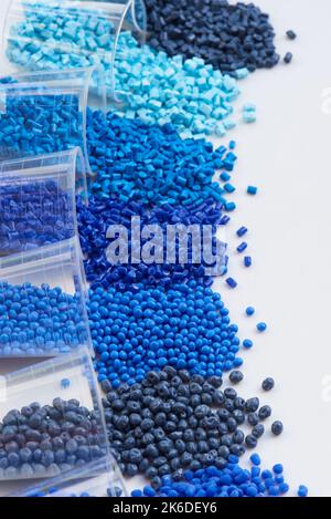 different blue plastic resin granulates for injection moulding process in different granulate types Stock Photo