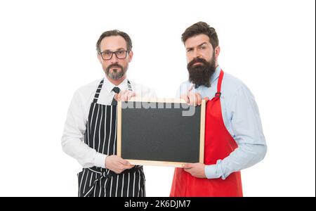 Workers wanted. Men bearded bartender or cook in apron hold blank chalkboard. Bartender with blackboard. Hipster bartender show blackboard copy space Stock Photo
