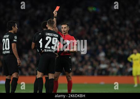 Tuta of Eintracht Frankfurt (c, partially hidden) is sent off as he receives a red card after a 2nd yellow by referee Carlos del Cerro Grande. UEFA Champions league, group D match, Tottenham Hotspur v Eintracht Frankfurt at the Tottenham Hotspur Stadium in London on Wednesday 12th October 2022. this image may only be used for Editorial purposes. Editorial use only, license required for commercial use. No use in betting, games or a single club/league/player publications. pic by Sandra Mailer/Andrew Orchard sports photography/Alamy Live news Stock Photo
