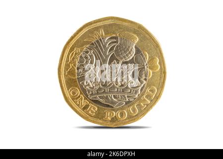 A close-up shot of the British one pound coin over a white background. Stock Photo