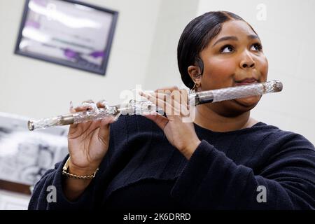 Washington, United States of America. 26 September, 2022. Pop singer and songwriter Lizzo plays a 200-years-old crystal flute during a tour of the Music Division at the Library of Congress, September 26, 2022 in Washington, D.C. The flute once belonged to the fourth President of the United States, James Madison.  Credit: Shawn Miller/Library of Congress/Alamy Live News Stock Photo