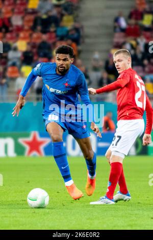 Bucharest, Romania. 13th Oct, 2022. October 13, 2022: Malcolm Edjouma #18 of FCSB and Sebastian Jorgensen #27 of Silkeborg IF during of the UEFA Europa Conference League group B match between FCSB Bucharest and Silkeborg IF at National Arena Stadium in Bucharest, Romania ROU. Catalin Soare/Cronos Credit: Cronos/Alamy Live News Stock Photo