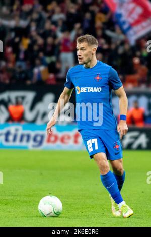Bucharest, Romania. 13th Oct, 2022. October 13, 2022: Darius Olaru #27 of FCSB during of the UEFA Europa Conference League group B match between FCSB Bucharest and Silkeborg IF at National Arena Stadium in Bucharest, Romania ROU. Catalin Soare/Cronos Credit: Cronos/Alamy Live News Stock Photo
