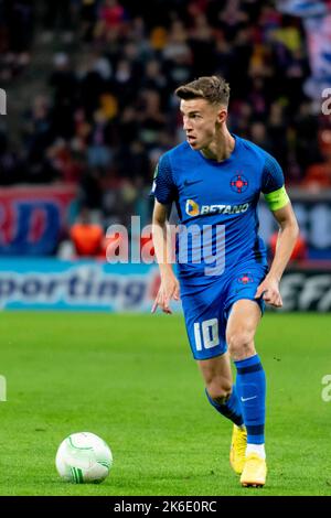Bucharest, Romania. 13th Oct, 2022. October 13, 2022: Octavian Popescu #10 of FCSB during of the UEFA Europa Conference League group B match between FCSB Bucharest and Silkeborg IF at National Arena Stadium in Bucharest, Romania ROU. Catalin Soare/Cronos Credit: Cronos/Alamy Live News Stock Photo