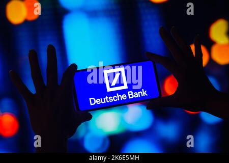 In this photo illustration, the Deutsche Bank logo is displayed on a smartphone screen. Stock Photo