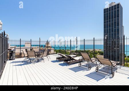 A rooftop patio on a Chicago skyscraper looking out over North Avenue Beach and Lake Michigan. Stock Photo