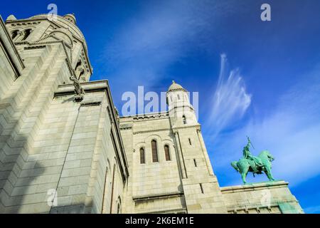 Basilica of Sacre-Coeur in Montmartre at sunny day with cloudscape, Paris Stock Photo