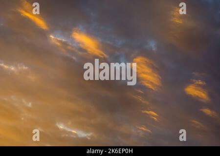 Sunrise dramatic sky with clouds in a row, colorful cloudscape Stock Photo
