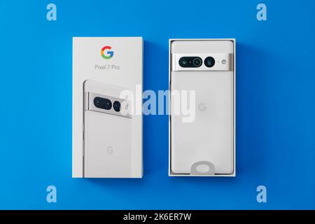 Melbourne, Australia - Oct 14, 2022: Top down view of unboxing a brand new Google Pixel 7 Pro against blue background Stock Photo