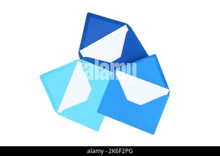 Envelopes of blue hues with blank white card isolated on white background, viewed from above. Top view Stock Photo