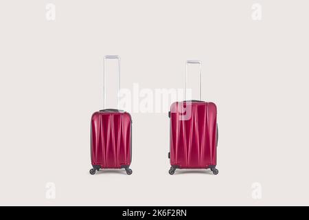 Stylish red suitcases isolated on white background Stock Photo