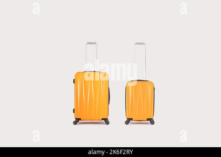 Stylish yellow suitcases isolated on white background Stock Photo