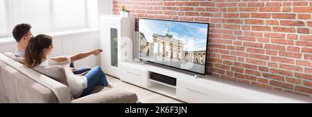 Couple Watching TV At Home. Television Screen Stock Photo
