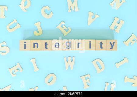 Integrity core values concept in business, company and organization. Word typography on wooden blocks flat lay. Stock Photo