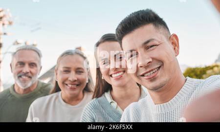 Through ups and downs, family will stand by each other. a couple spending time outdoors with their parents. Stock Photo