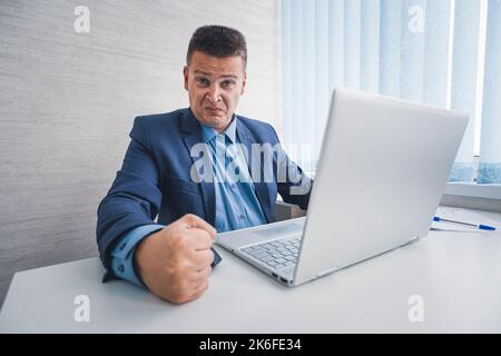 Dealing with anger at work. man feel anger at work. Businessman show fist in anger. Anger managements. Managing stress. Business problem and conflict. Stock Photo
