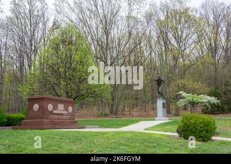 Jim Thorpe, Pennsylvania, United States of America – April 30, 2017. The site of Jim Thorpe Memorial, with marble tomb and monument in a park outside Stock Photo