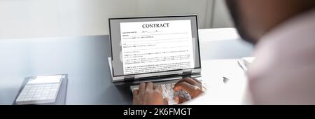 Legal Law Contract On Convertible Laptop Screen Stock Photo