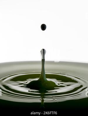 Water drop splashes are isolated on white background. Stock Photo