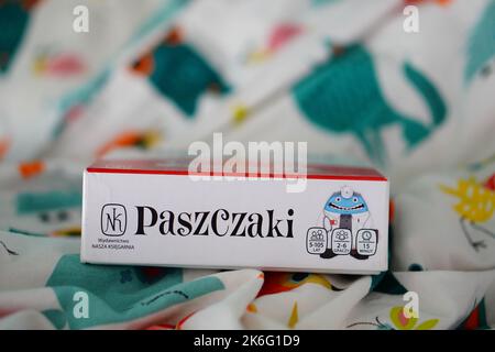 A closeup of the Polish Paszczaki card game in a box isolated on a bed sheet Stock Photo