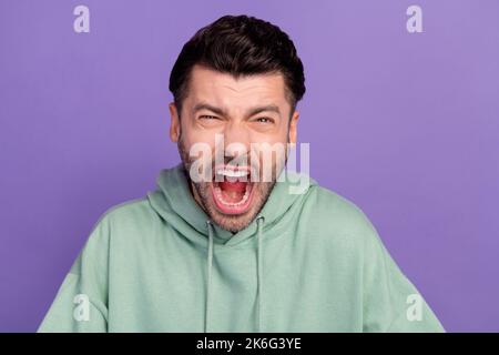 Closeup photo of young agressive employer man bristle brunet scream loud noise dont like deadline problems failed isolated on purple color background Stock Photo
