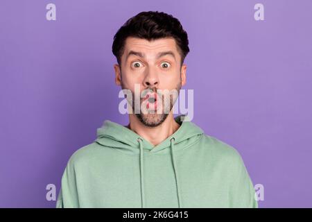 Closeup photo of young funny impressed student guy wear sportswear hoodie open mouth unexpected reaction first salary isolated on violet color Stock Photo